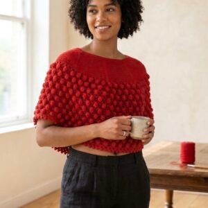 A vibrant scarlet-red capelet-style poncho